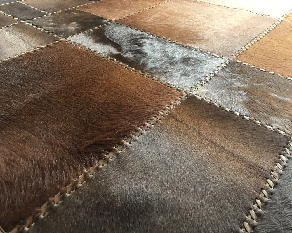 Heritage Brown Cowhide Rug – Hand-Laced Geometric Leather Patchwork Area Rug