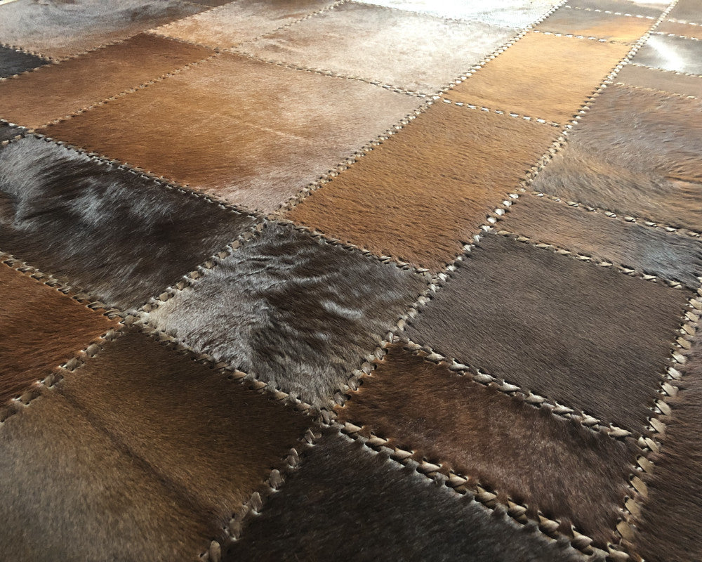 Heritage Brown Cowhide Rug – Hand-Laced Geometric Leather Patchwork Area Rug