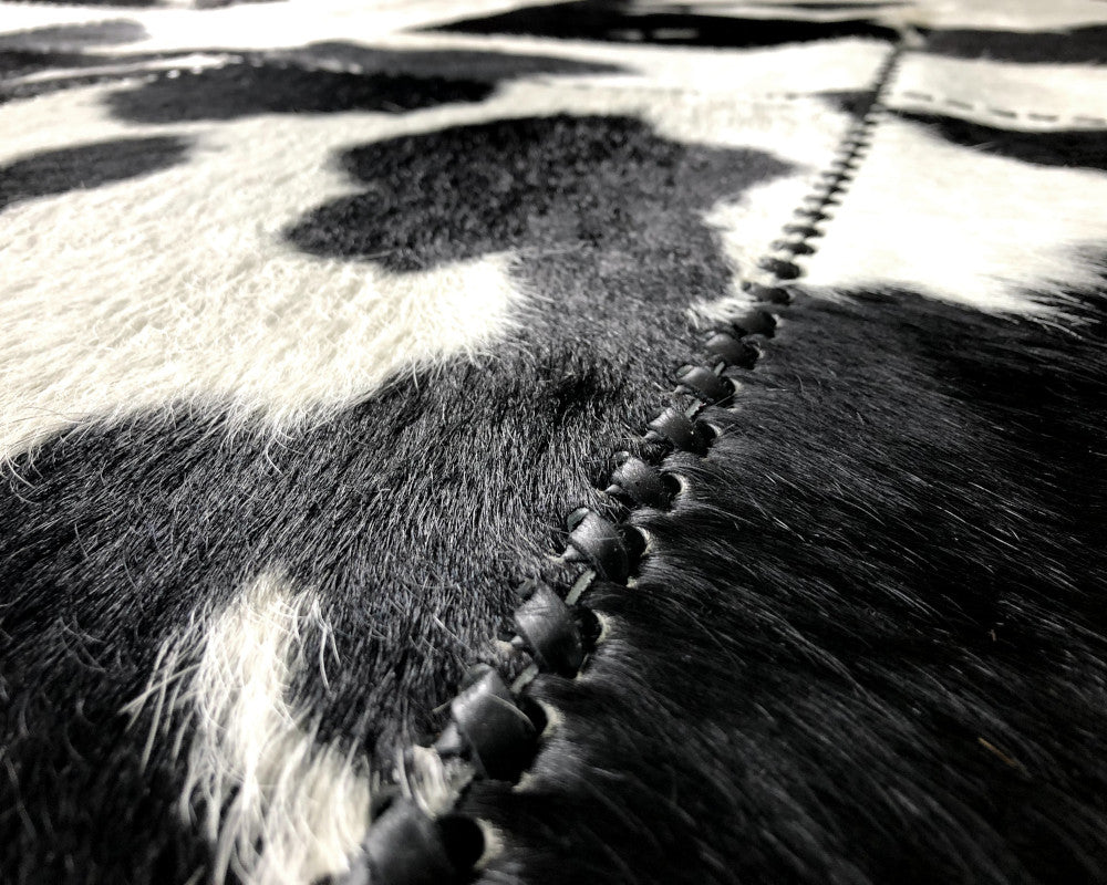 High-Contrast Black White Cowhide Rug – Hand-Laced Patchwork Area Rug