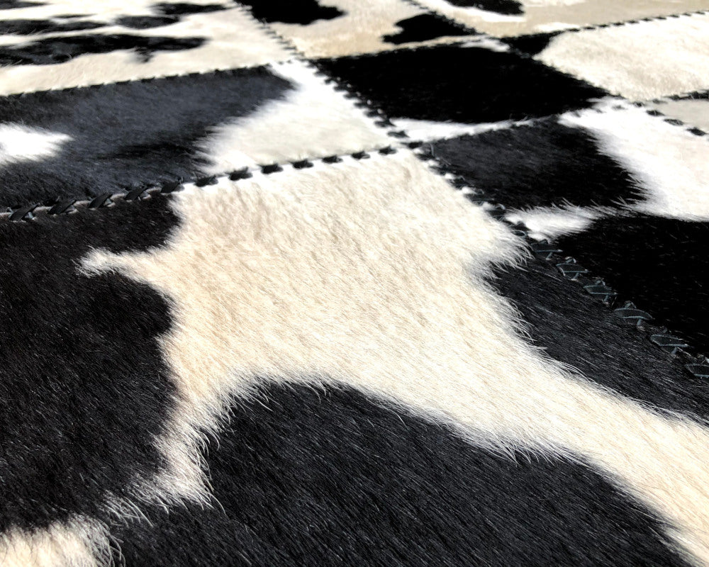 Black & White Spotted Cowhide Rug – Hand-Laced Patchwork Area Rug