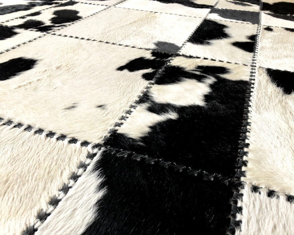 Black & White Spotted Cowhide Rug – Hand-Laced Patchwork Area Rug