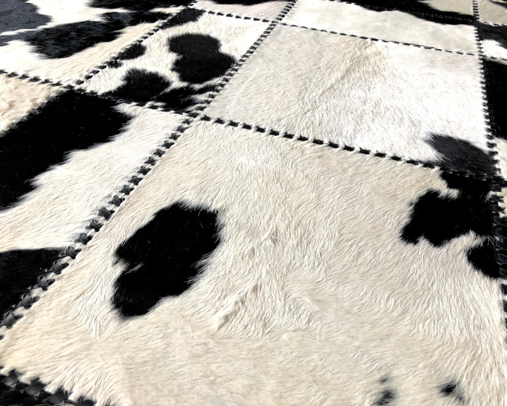 Black & White Spotted Cowhide Rug – Hand-Laced Patchwork Area Rug