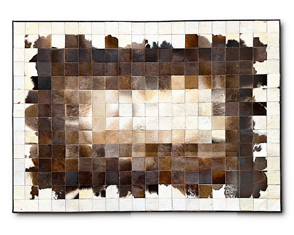 Add timeless character to your interior with this handmade Ivory Frame Cowhide Patchwork Rug. Featuring hundreds of small square genuine hair-on cowhide patches