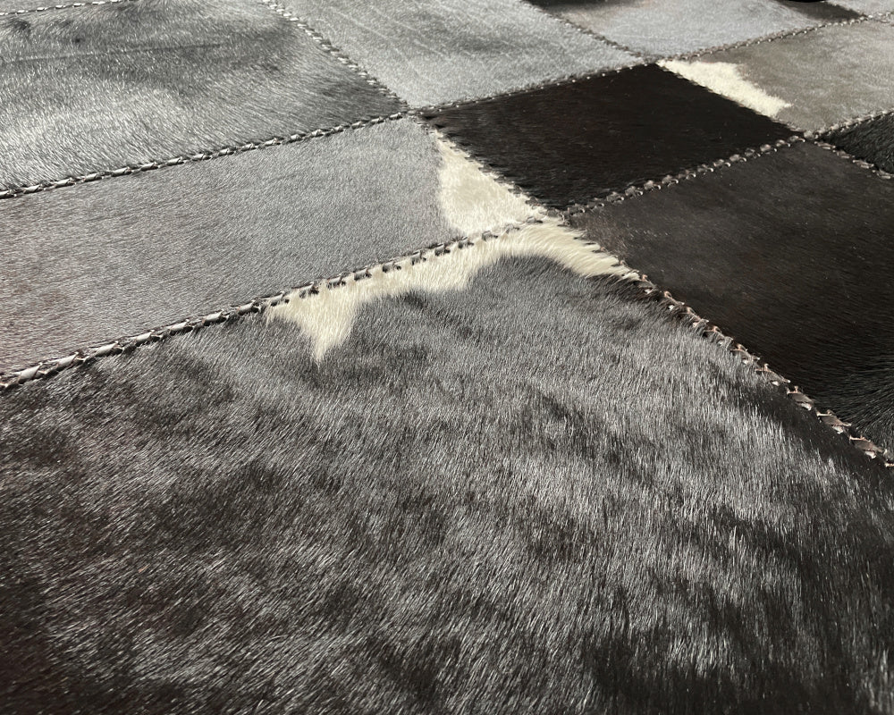 Raven Black Cowhide Rug – Hand-Laced Charcoal Patchwork Area Rug