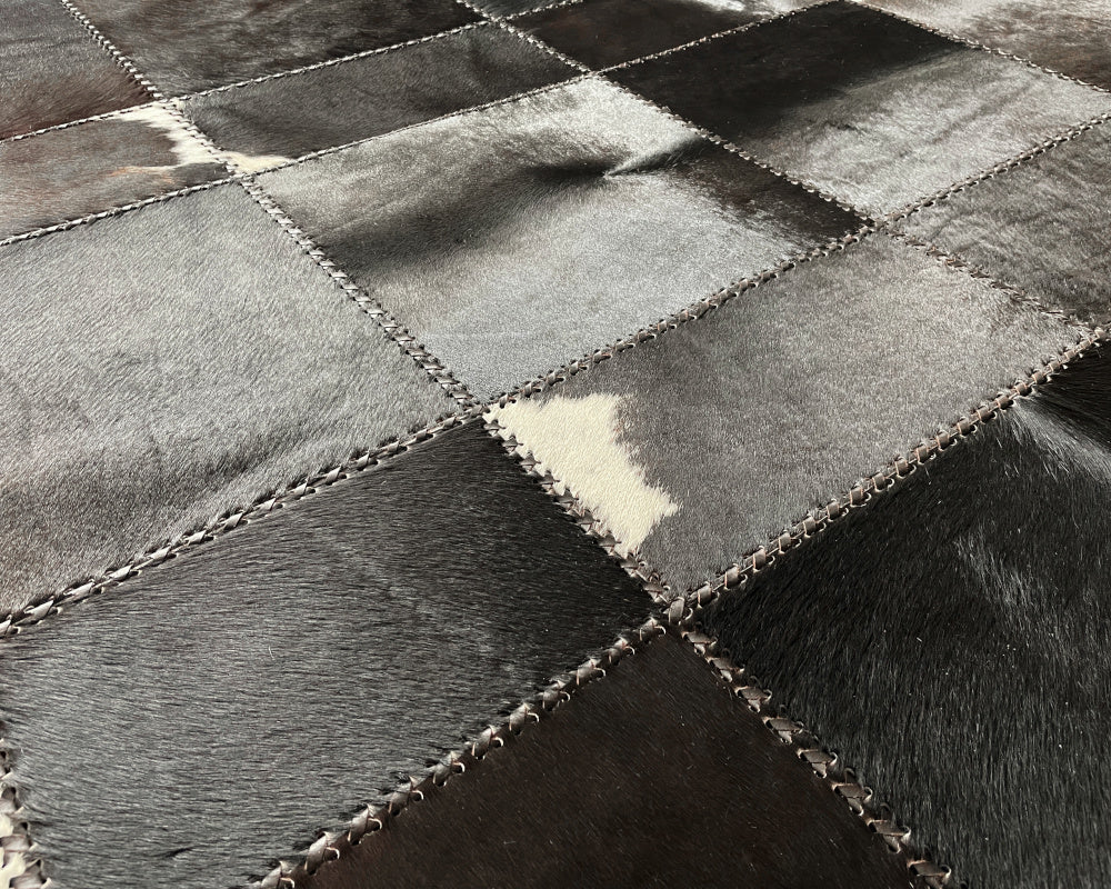 Raven Black Cowhide Rug – Hand-Laced Charcoal Patchwork Area Rug