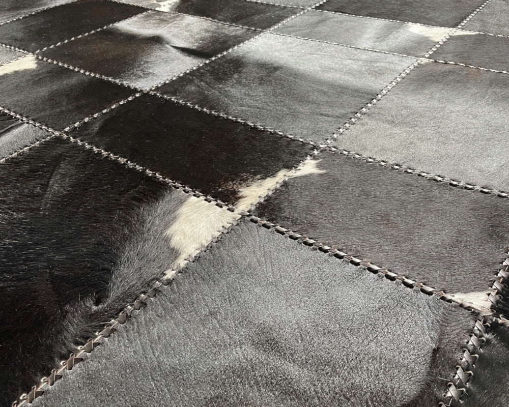 Raven Black Cowhide Rug – Hand-Laced Charcoal Patchwork Area Rug