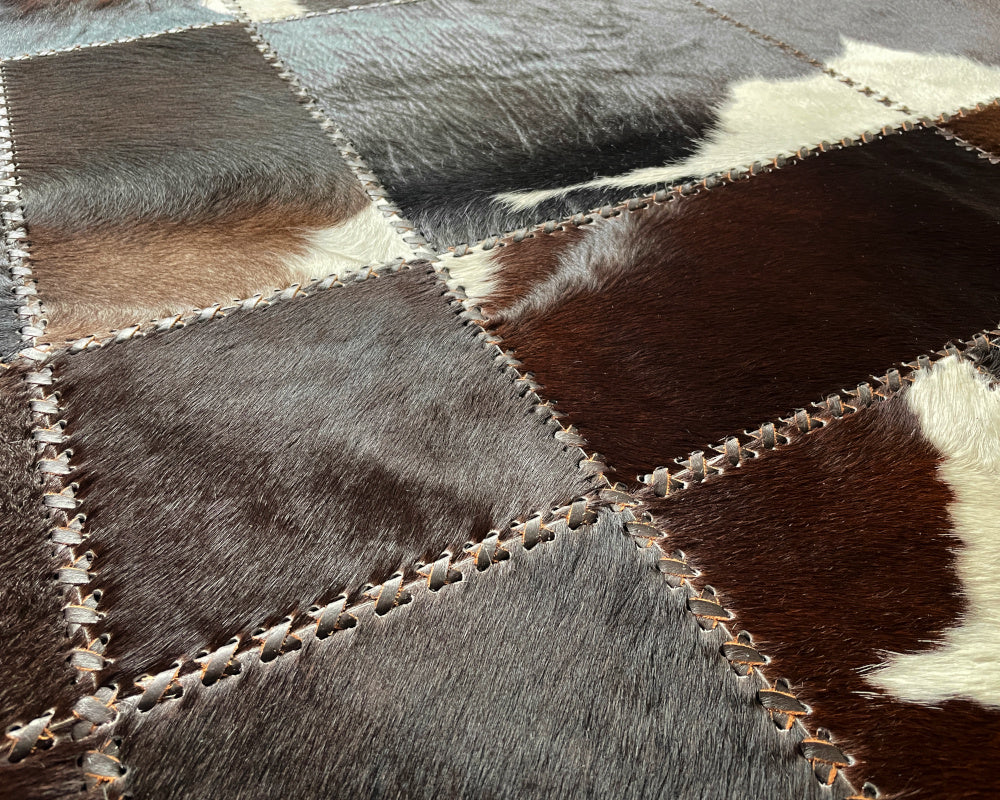 Onyx Black Cowhide Rug – Hand-Laced Spotted Patchwork Area Rug