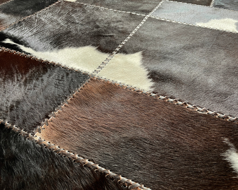 Onyx Black Cowhide Rug – Hand-Laced Spotted Patchwork Area Rug