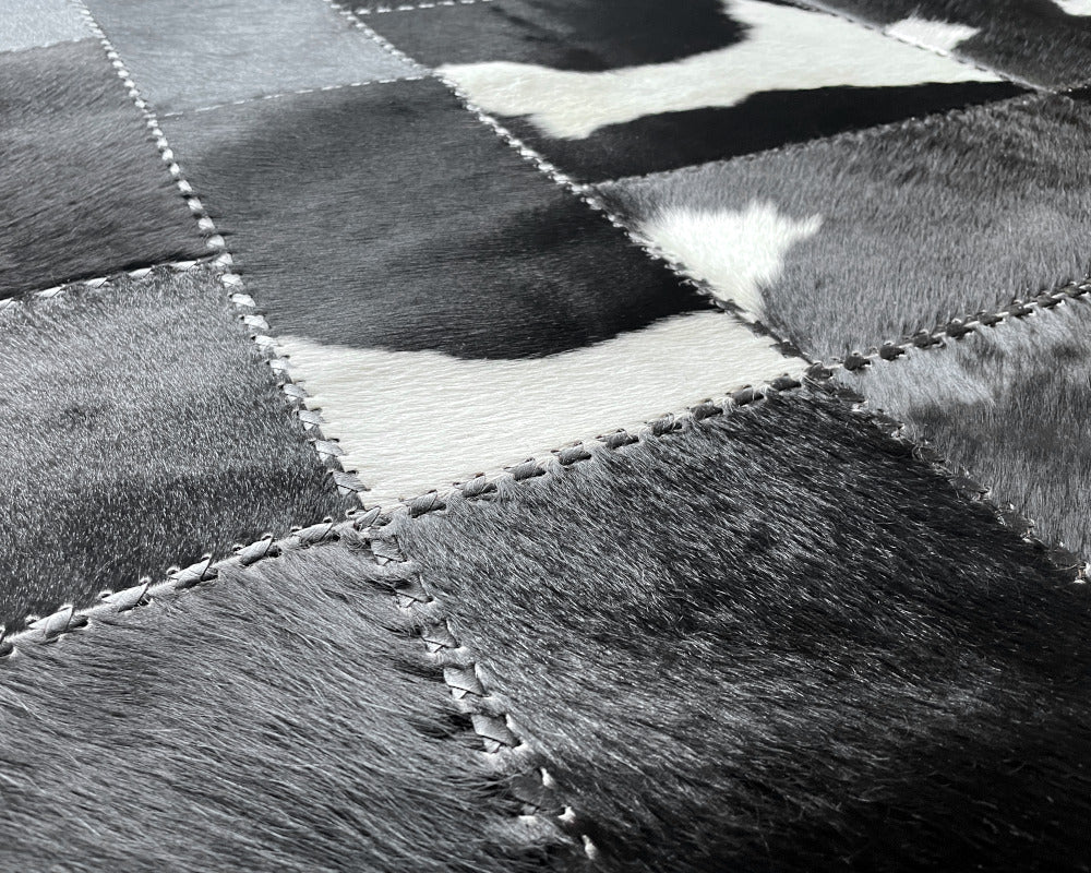 Midnight Black Cowhide Rug – Hand-Laced Charcoal Patchwork Area Rug