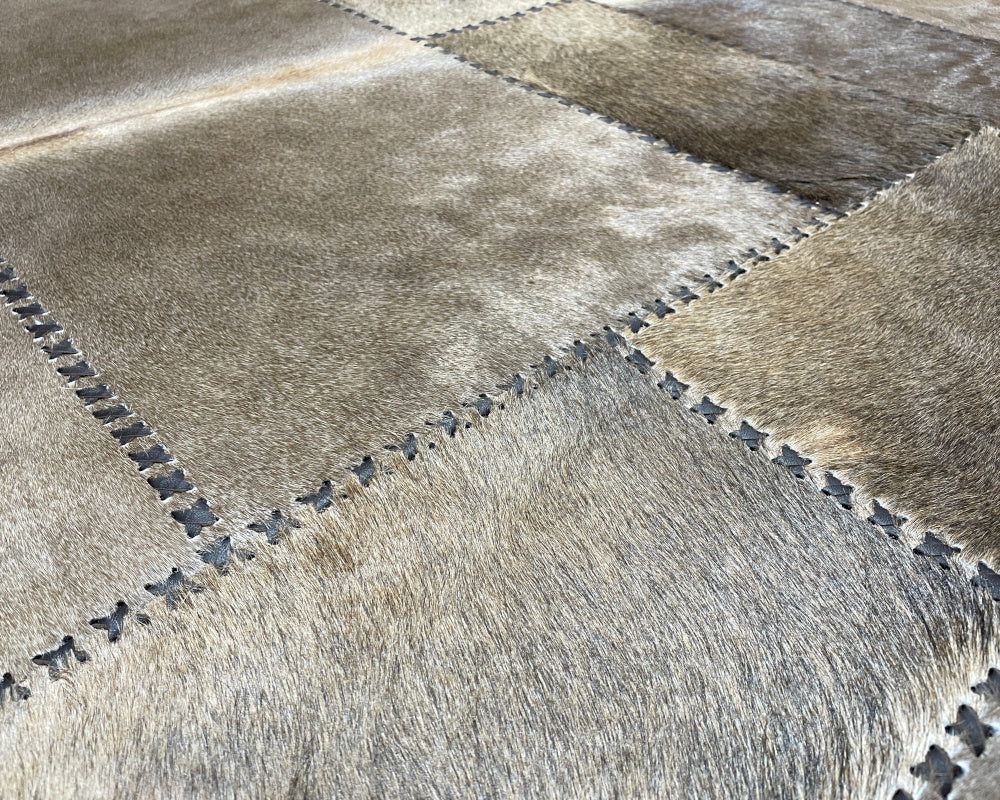 Champagne Beige Cowhide Rug – Hand-Laced Framed Patchwork Area Rug