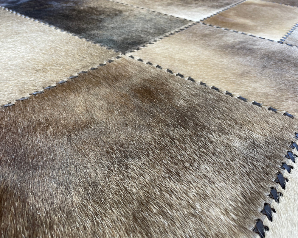 Stone Ivory Cowhide Rug – Hand-Laced Framed Patchwork Area Rug