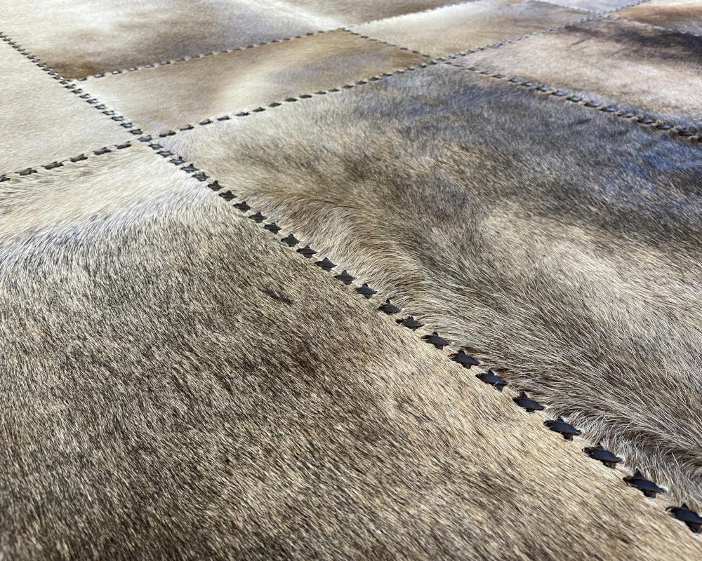 Stone Ivory Cowhide Rug – Hand-Laced Framed Patchwork Area Rug