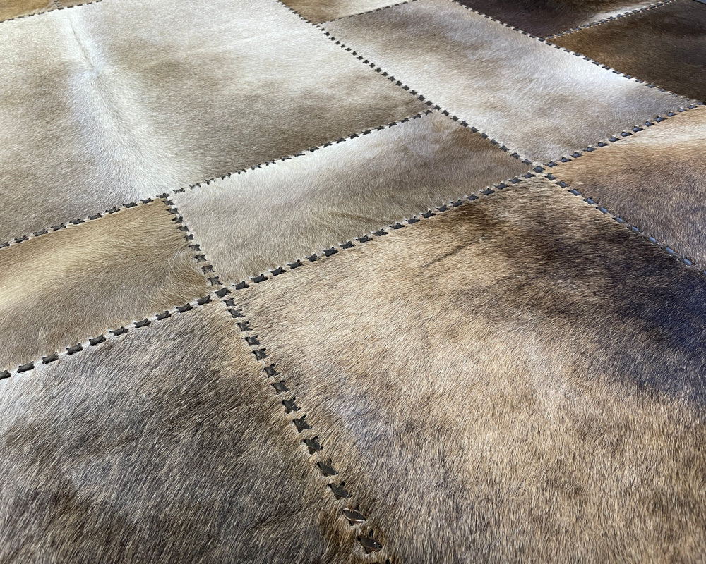 Stone Ivory Cowhide Rug – Hand-Laced Framed Patchwork Area Rug