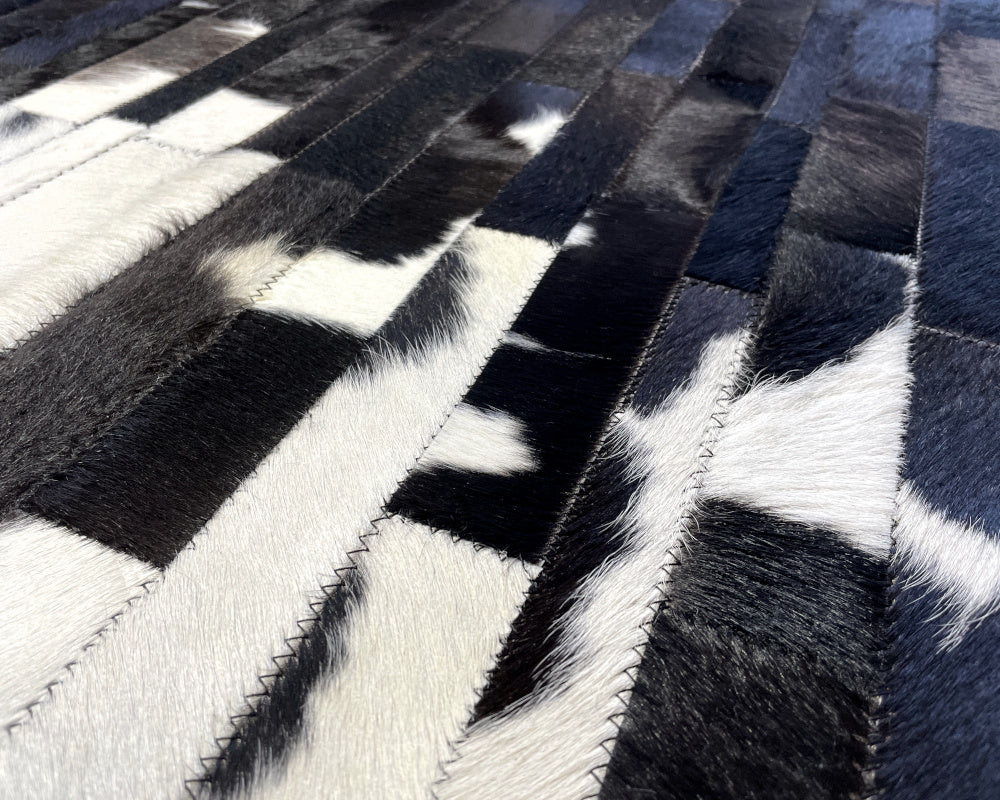 Monochrome Cowhide Patchwork Rug – Black Center & White Vertical Strip Mosaic Area Rug