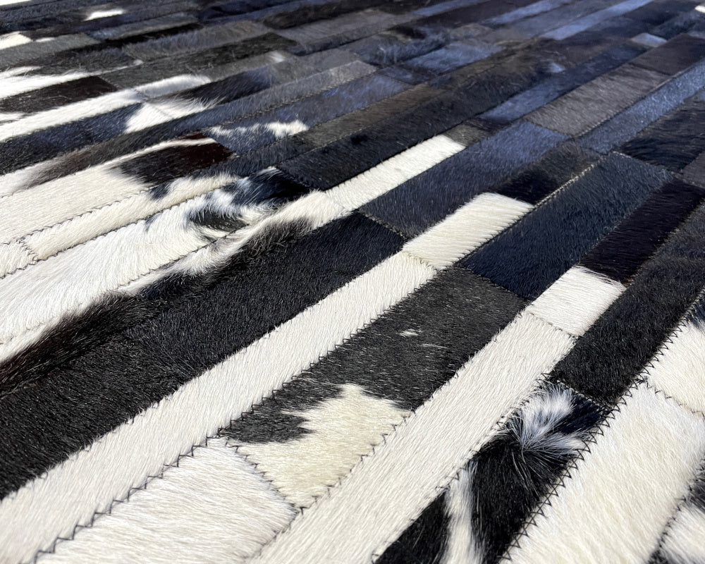 Monochrome Cowhide Patchwork Rug – Black Center & White Vertical Strip Mosaic Area Rug