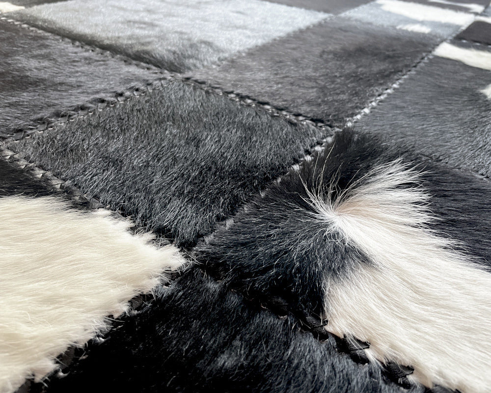 Tuxedo Black & White Cowhide Rug – Hand-Laced Geometric Patchwork Area Rug