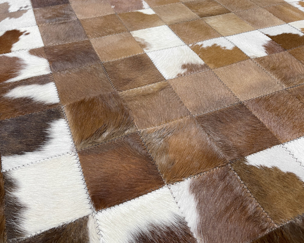 Golden Tan Cowhide Patchwork Rug – Brown & White Spotted Geometric Mosaic Area Rug