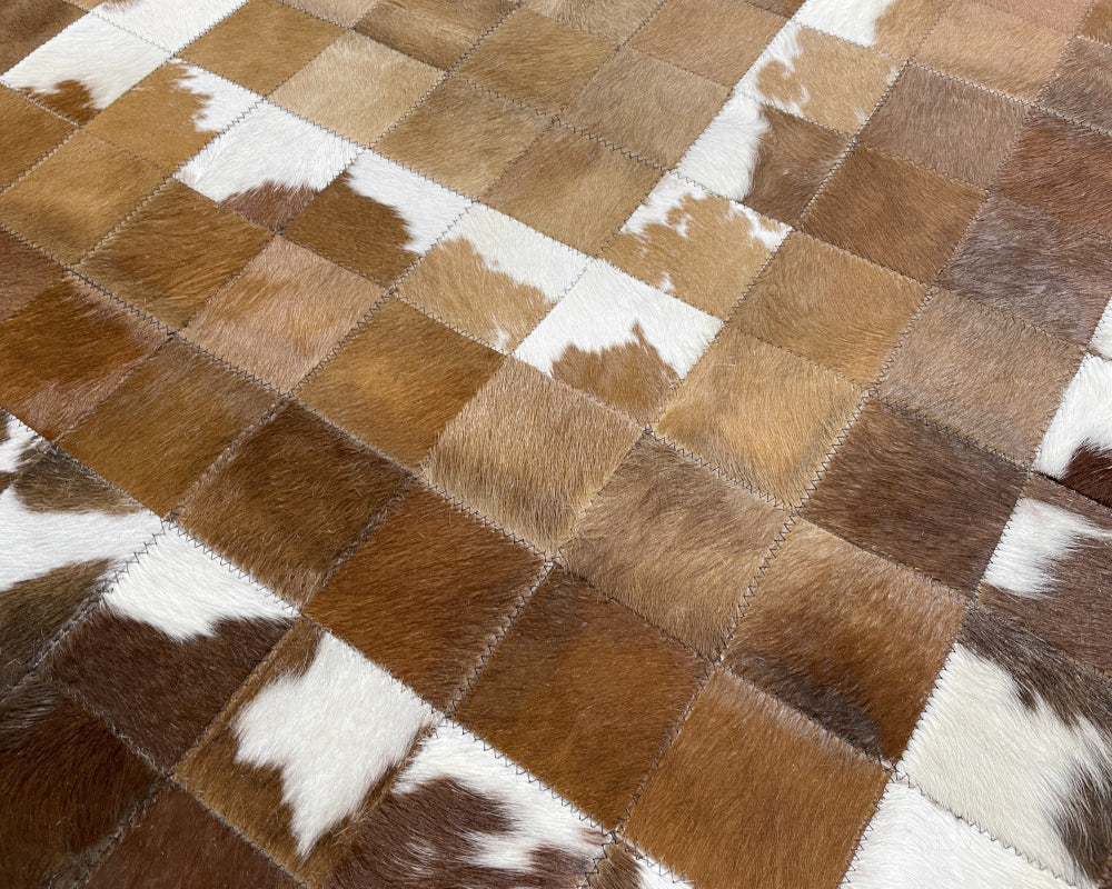 Golden Tan Cowhide Patchwork Rug – Brown & White Spotted Geometric Mosaic Area Rug