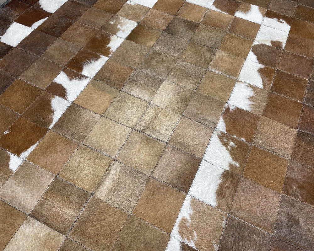 Golden Tan Cowhide Patchwork Rug – Brown & White Spotted Geometric Mosaic Area Rug