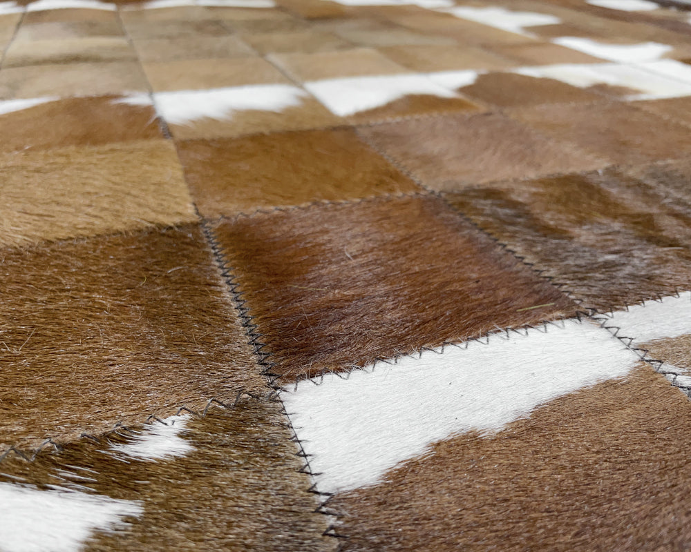Golden Tan Cowhide Patchwork Rug – Brown & White Spotted Geometric Mosaic Area Rug