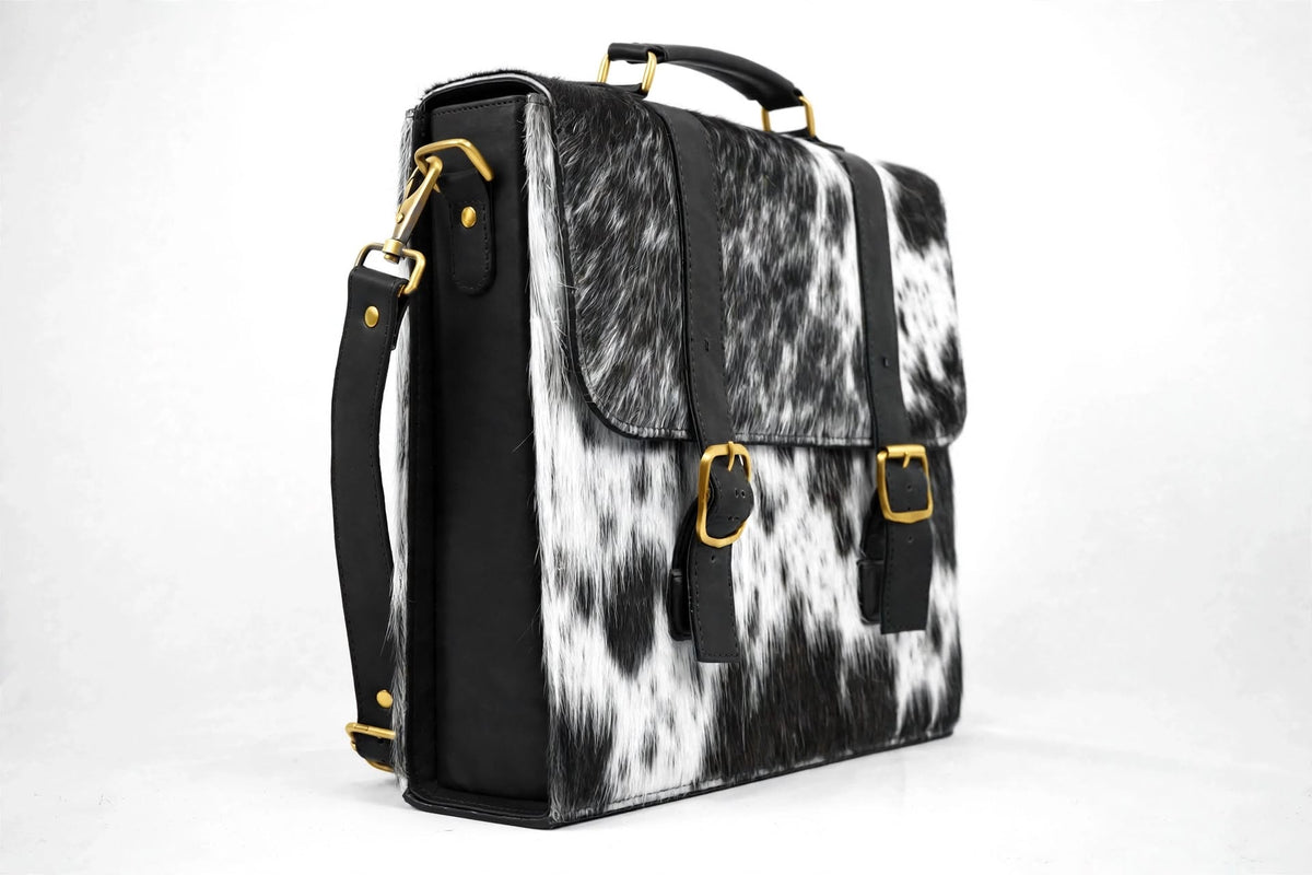quarter view of cowhide satchel showing depth and structure