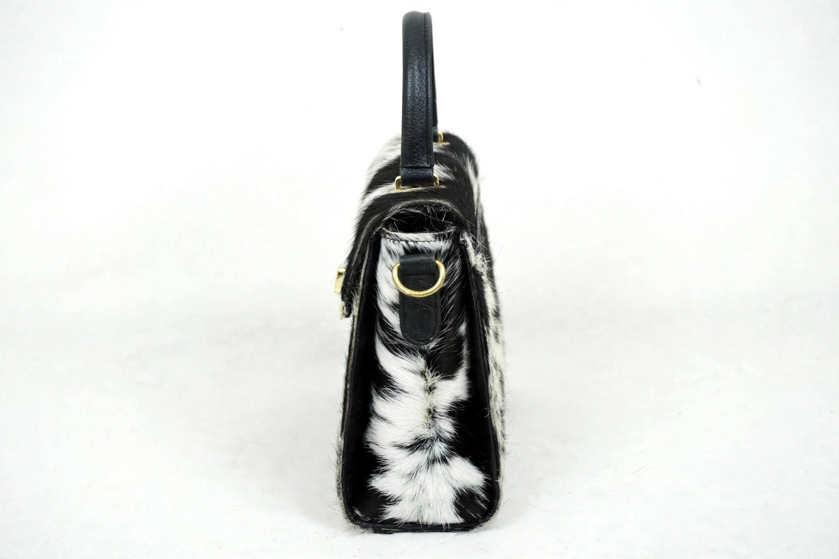 Genuine cowhide hair on hide satchel bag side profile view - women's crossbody handbag